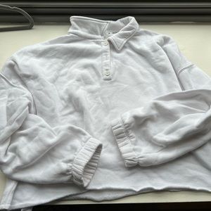 Cropped, cuffed, and collared white sweatshirt